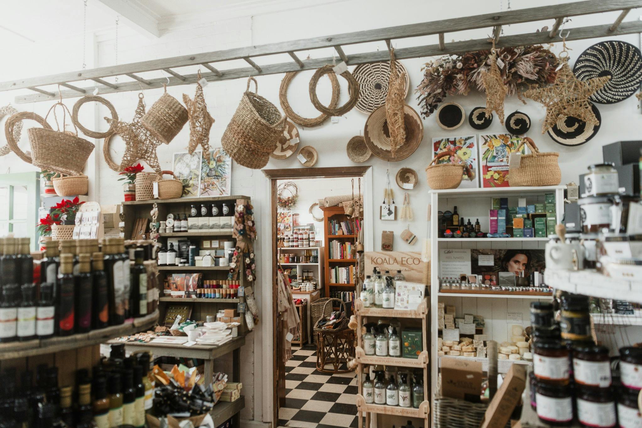 Inside of shop with hanging baskets from ladder