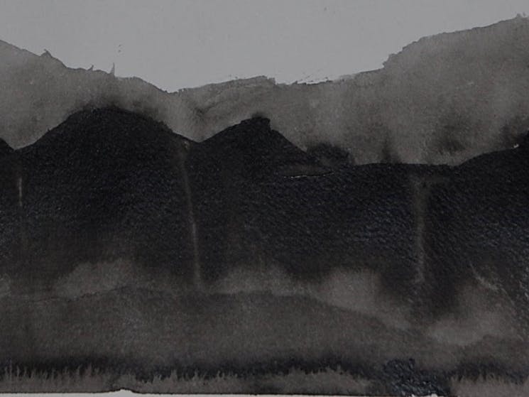 Black and white landscape of distant mountains