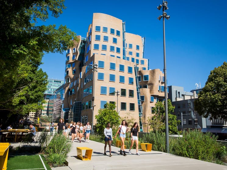 Students walking through The Goods Line - a pedestrian pathway and public space