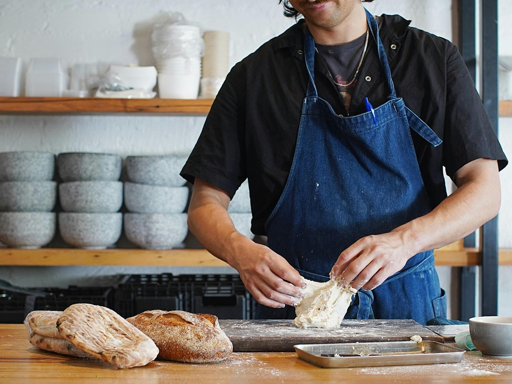 Chef shaping bread dough at the Bread and Baking workshop