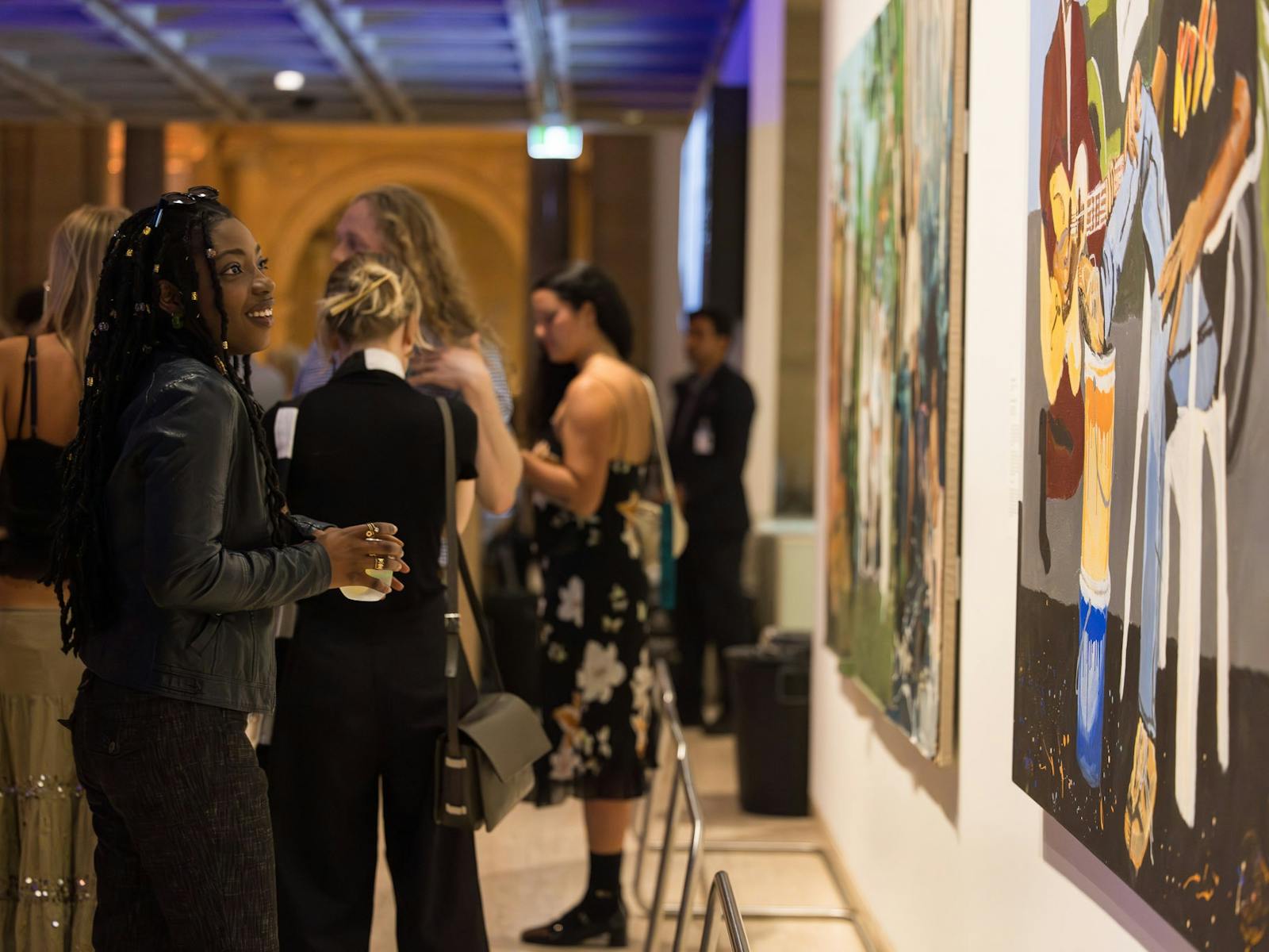 People looking at art during the Archie Party 2024