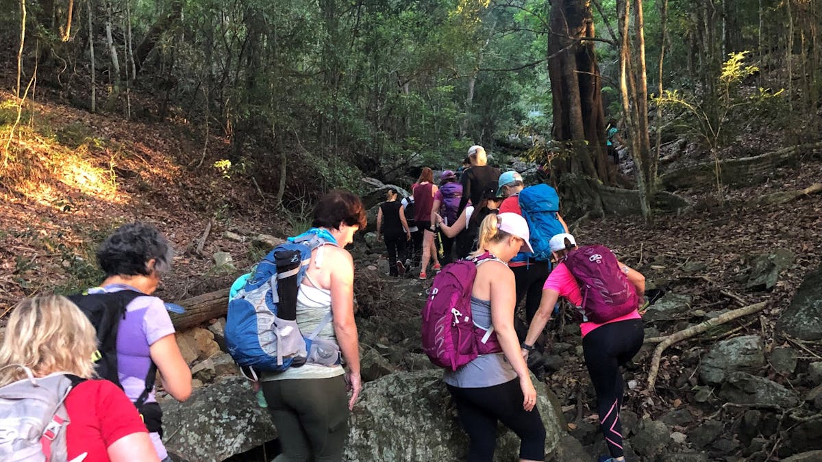Women walking up a rocky path at Mt Coot tha Brisbane