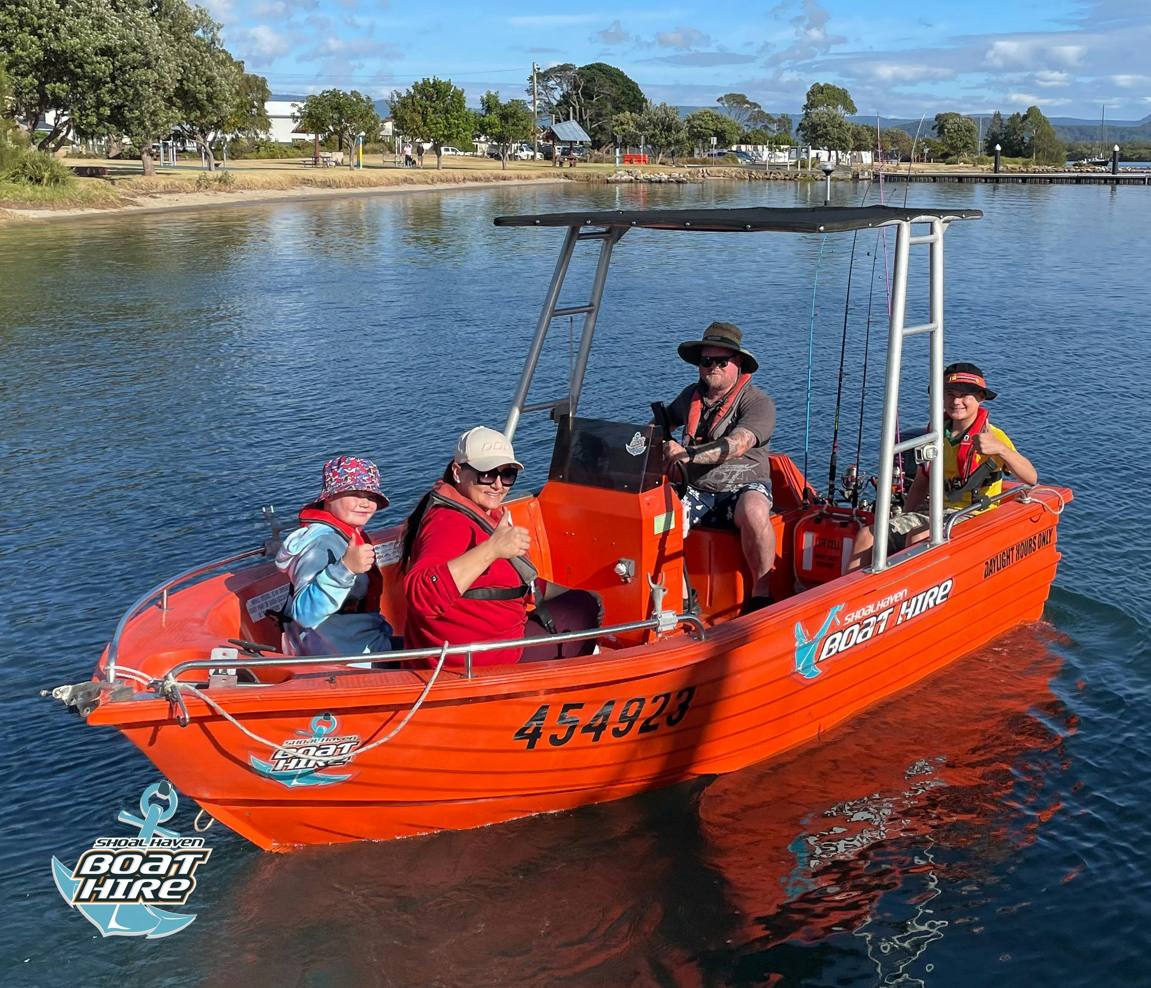 Family on orange polycraft boat.