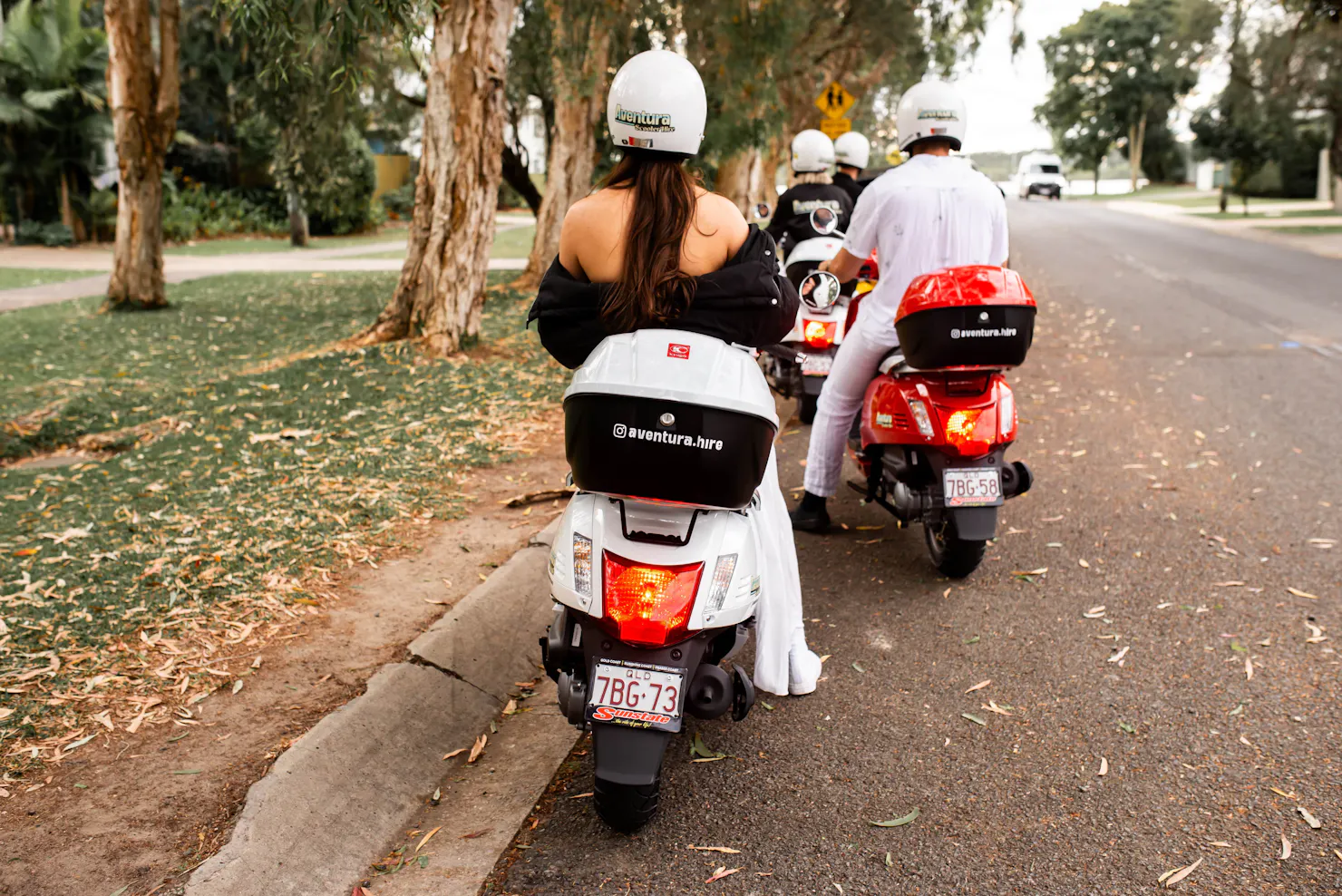 Group of people on hired scooters