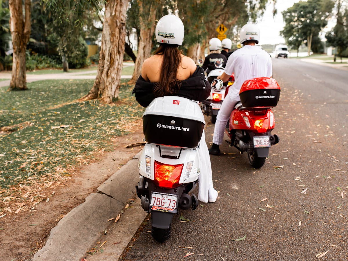 Group of people on hired scooters