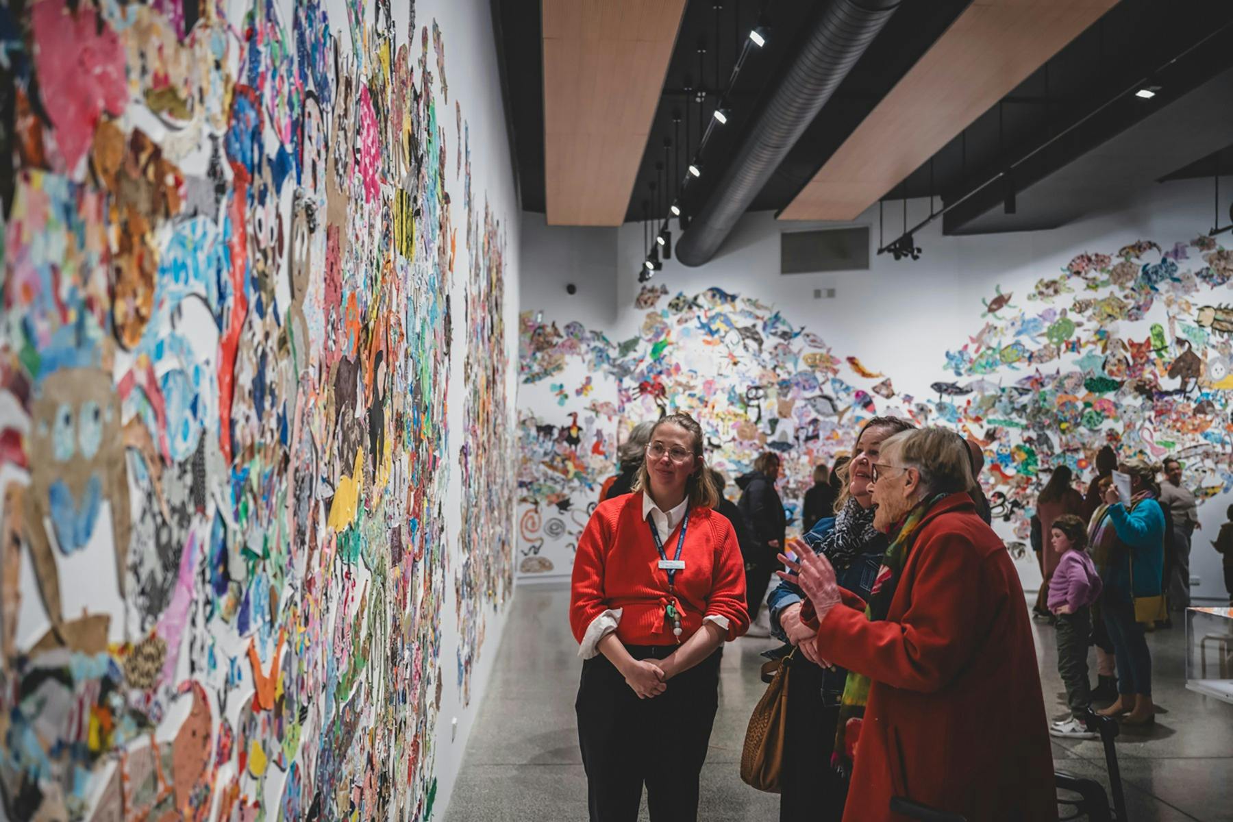 Visitors explore an exhibition at Orange Regional Museum