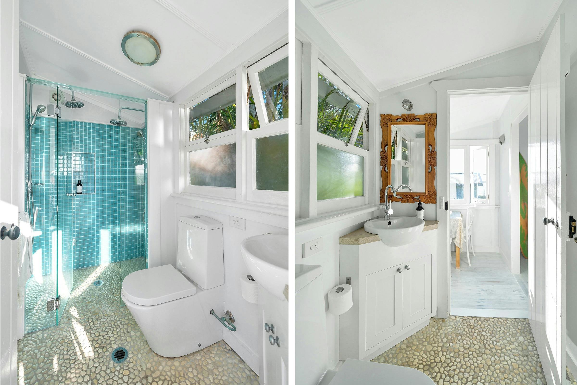 Bathroom at Aurora with dual showers overlooking a lush garden setting