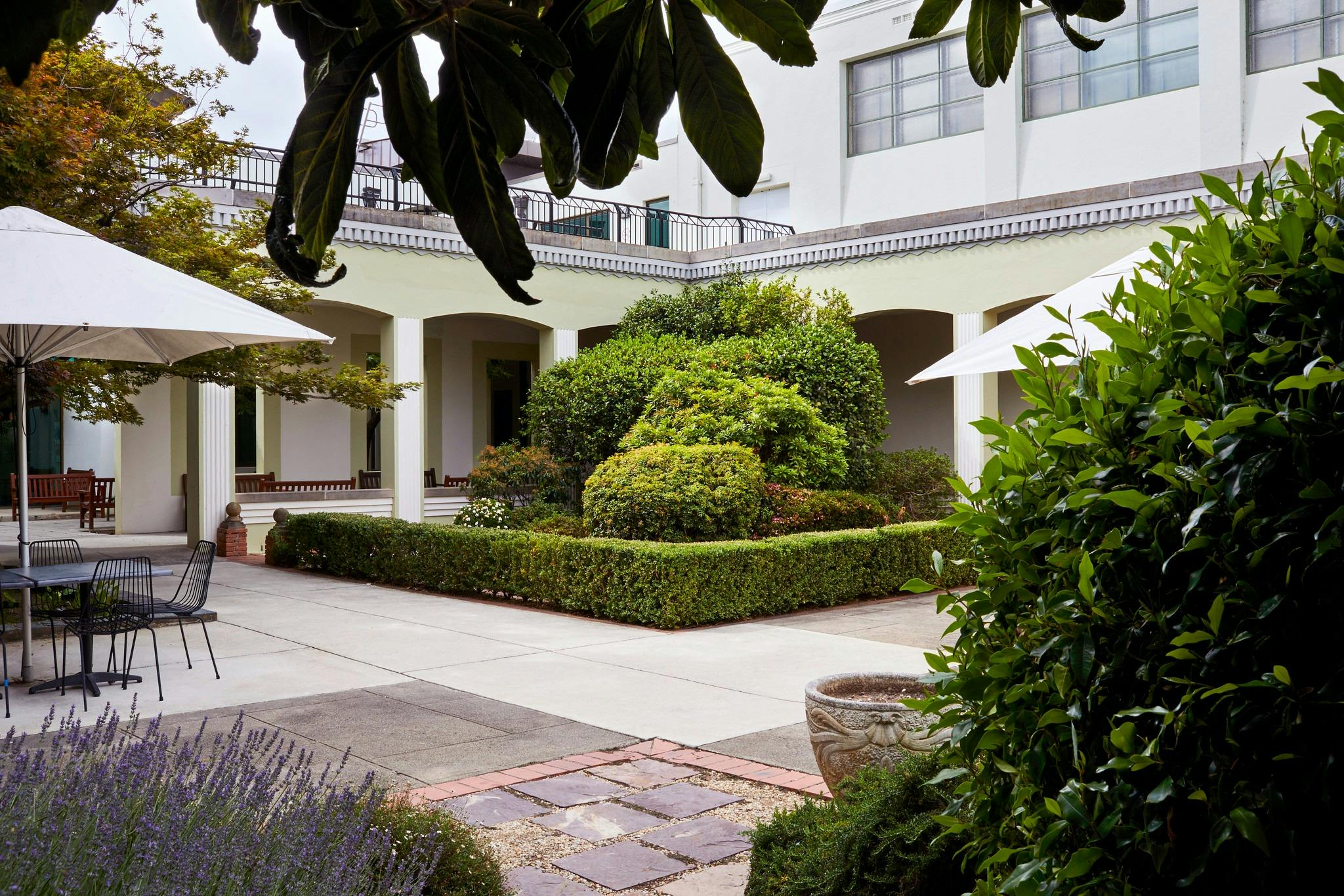 Courtyard with cafe tables and garden