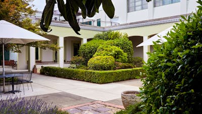 Courtyard with cafe tables and garden