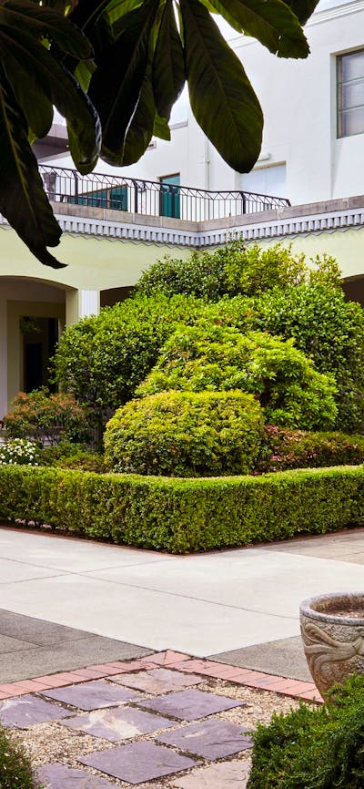 Courtyard with cafe tables and garden