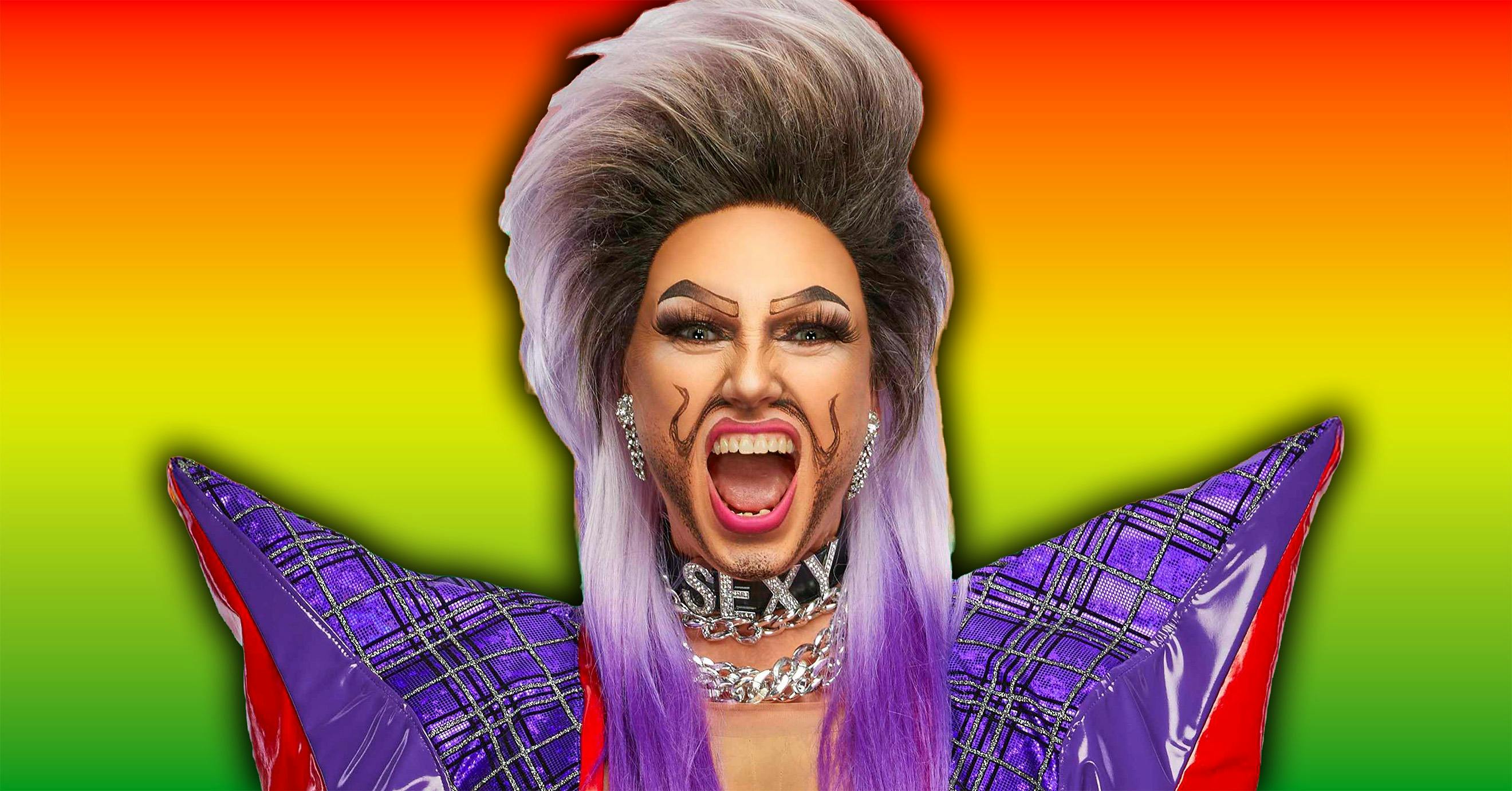 A rainbow backdrop with a drag performer in the foreground with a mullet and a shocked expressoin