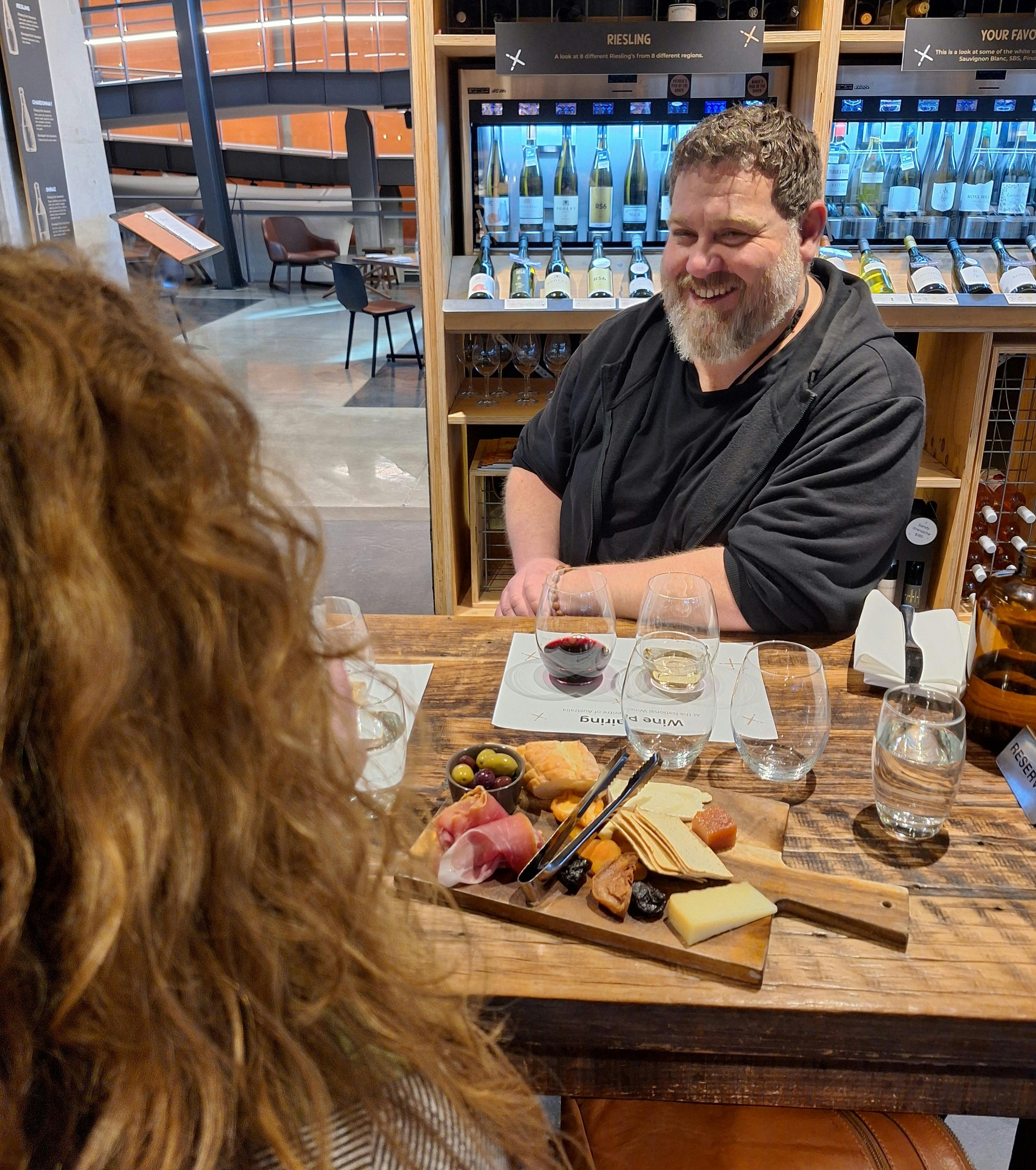 Radelaide Tour group enjoying wine and a chacuterie board at the National Wine centre, Adelaide,