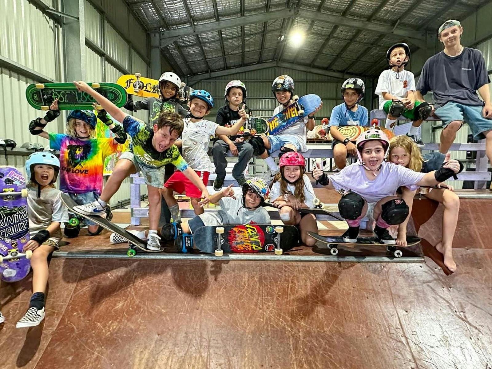 Kids with skateboards on ramp