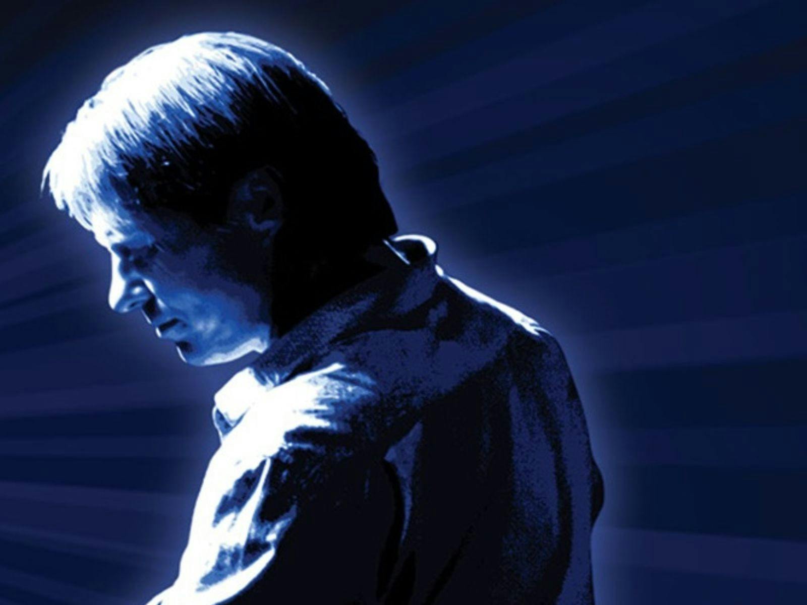 Silhoutte of Darren in dark blue background Silhoutte of Darren in dark blue background