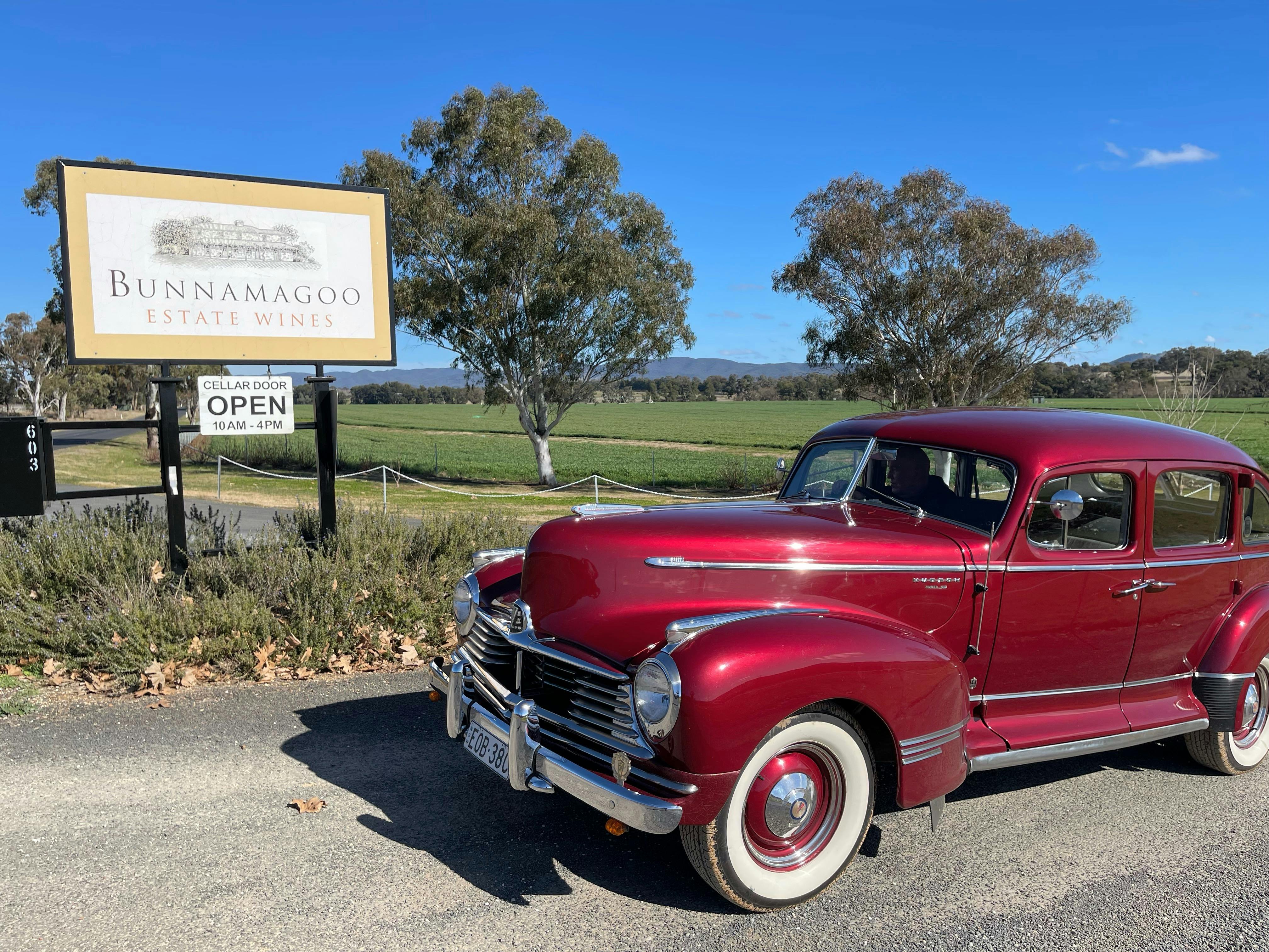 Red vintage car at a vineyard