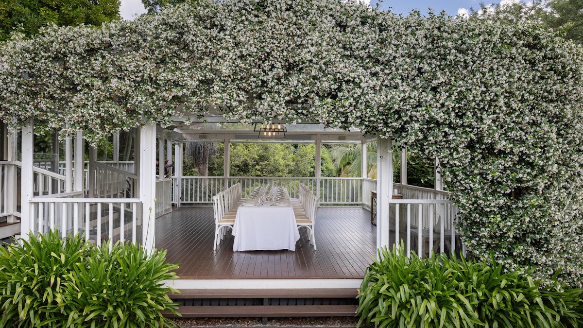 Long table event set up on the library deck of the estate