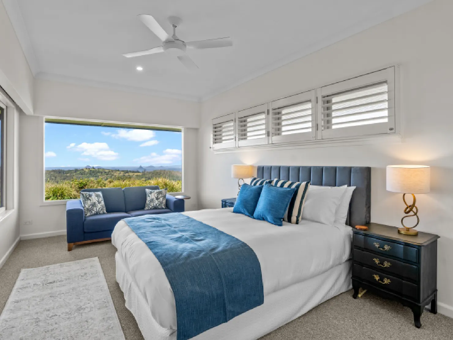 The Master bedroom has an ensuite bathroom, sitting area and views of the Glasshouse Mountains