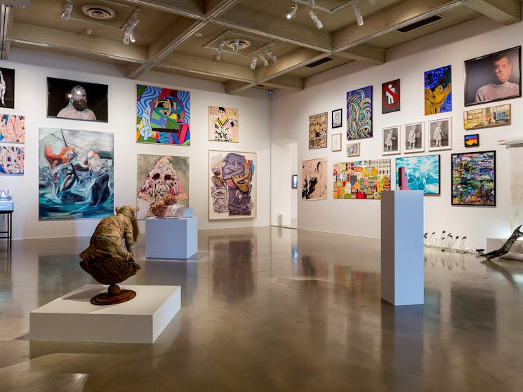 A selection of artworks including paintings and sculpture in the gallery space