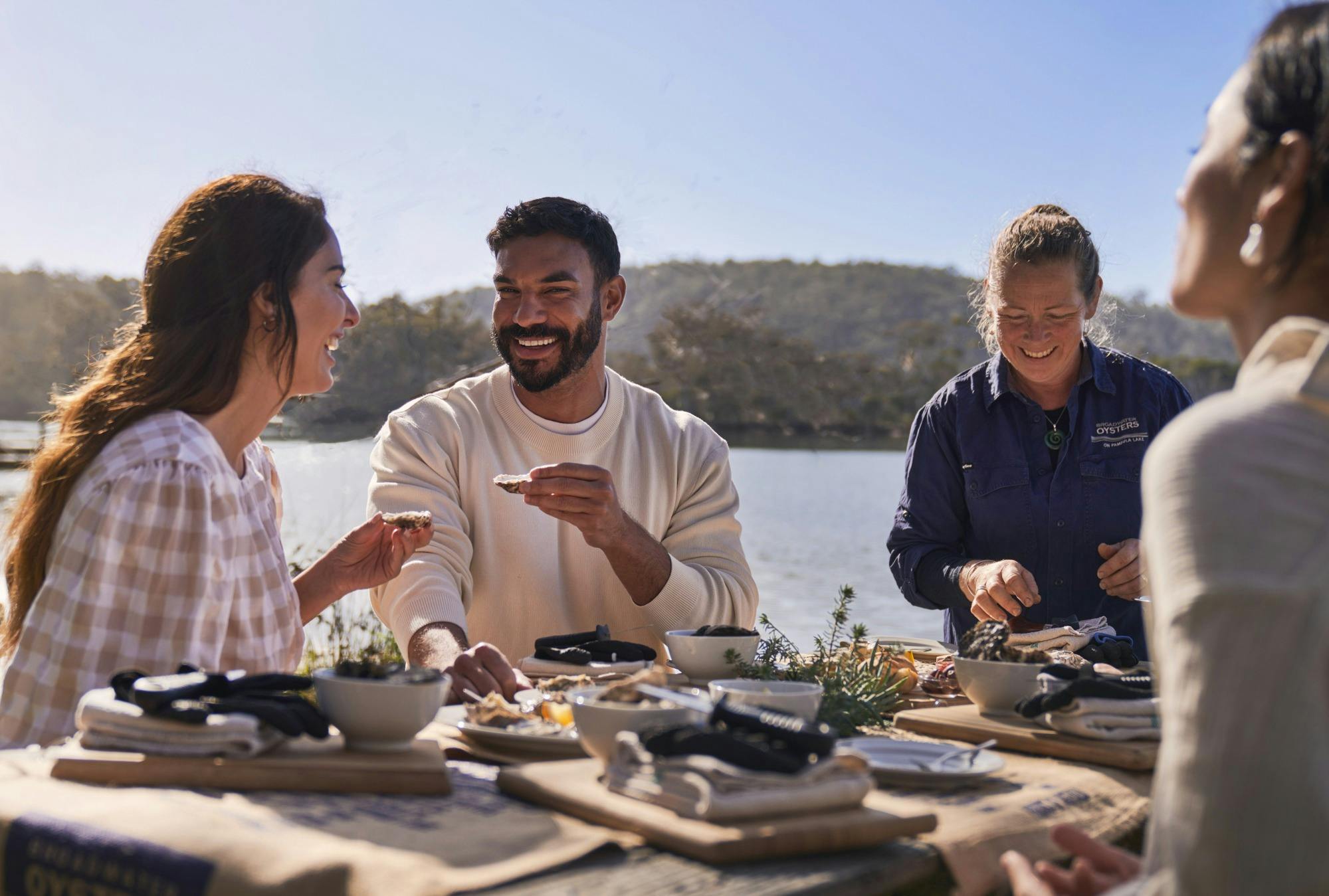 Guests tasting oysters
