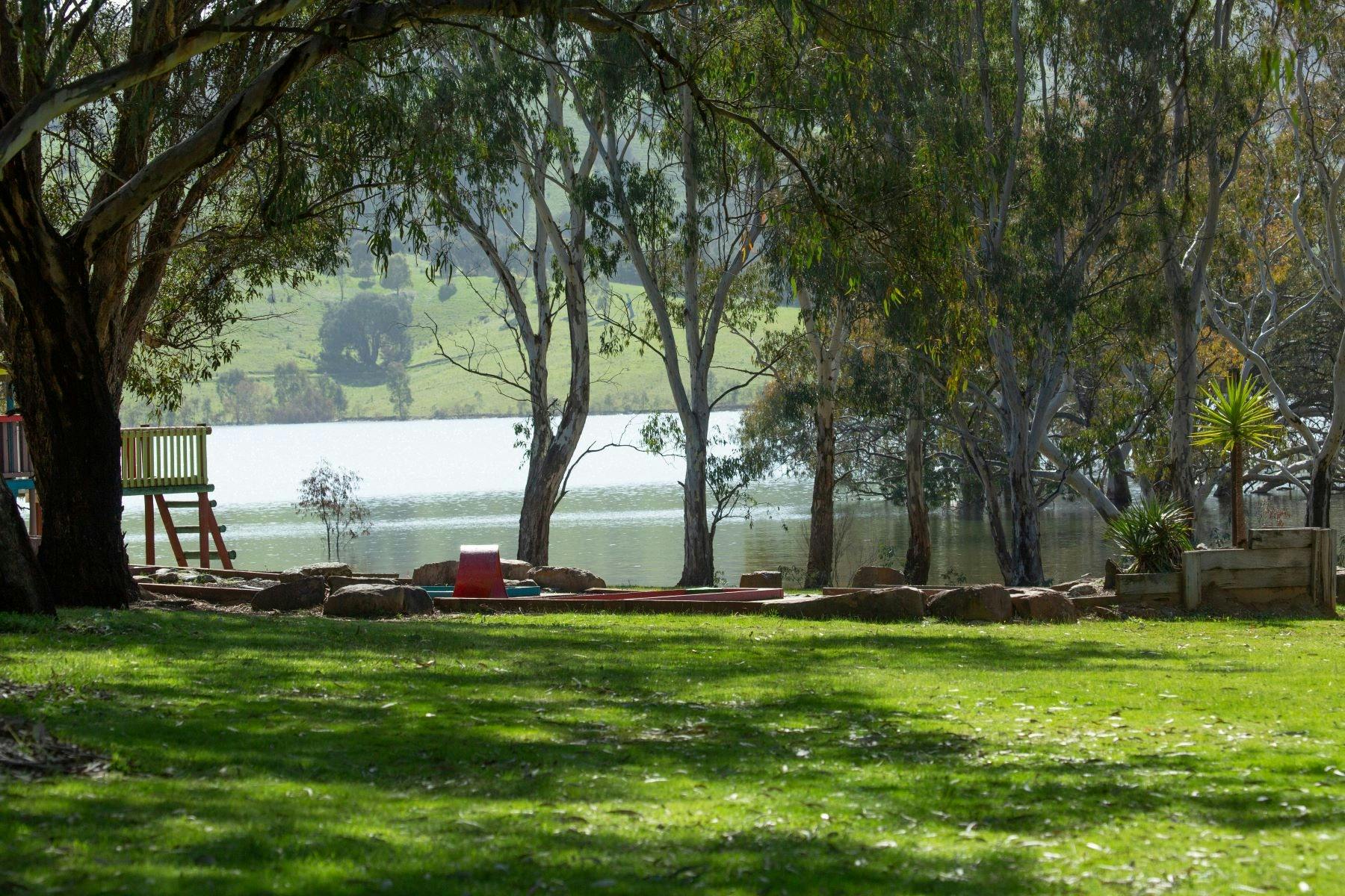 Grass area with lake in background