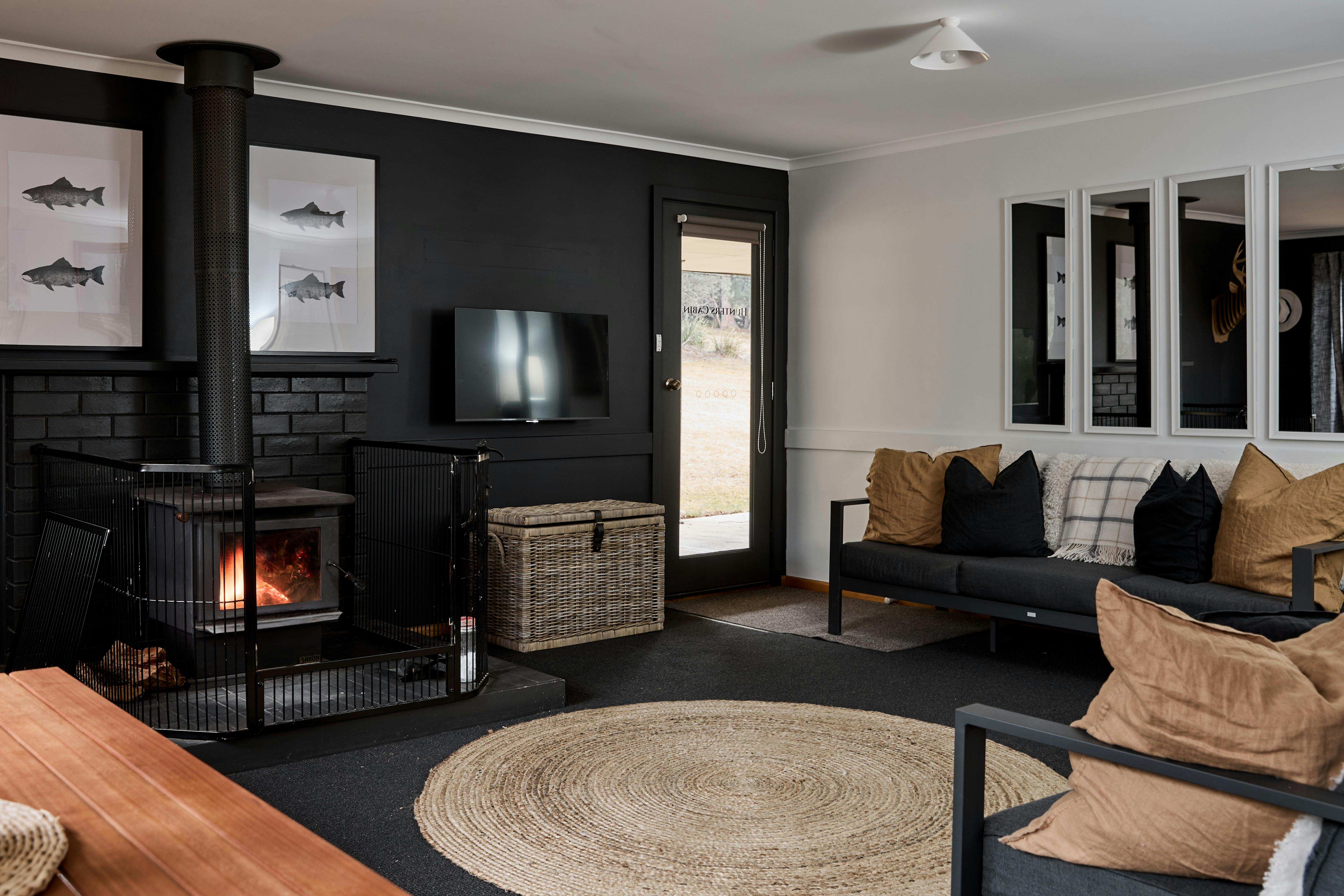 A warm woodfire within a shared lounge space