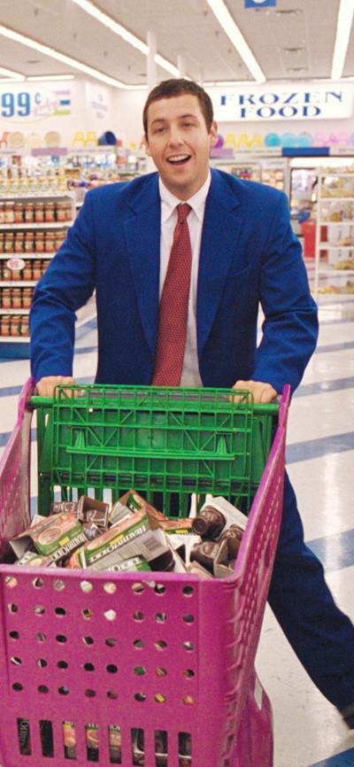 Two men in shopping centre with pink shopping trolleyrs