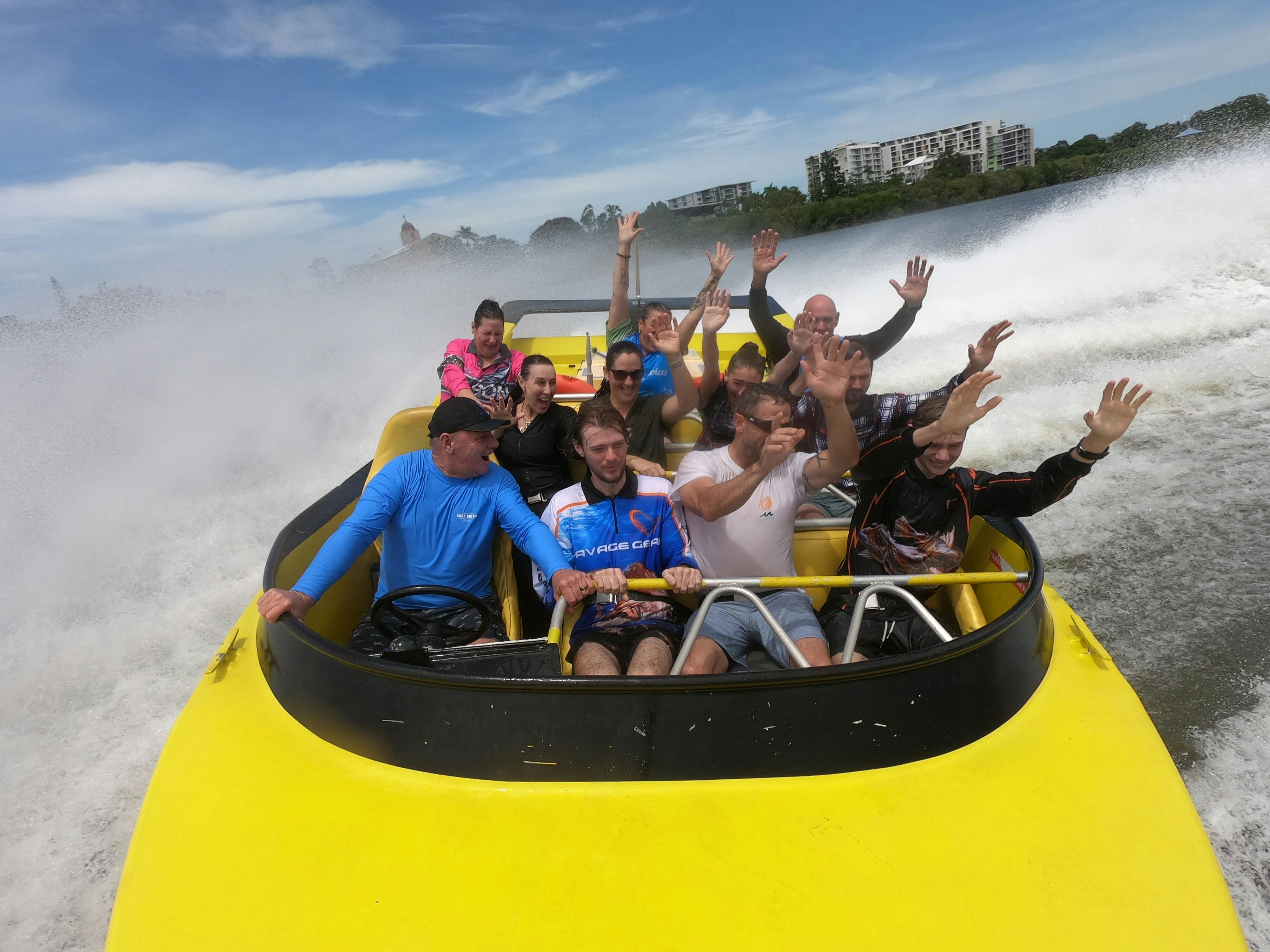 Passengers enjoying jet boat ride