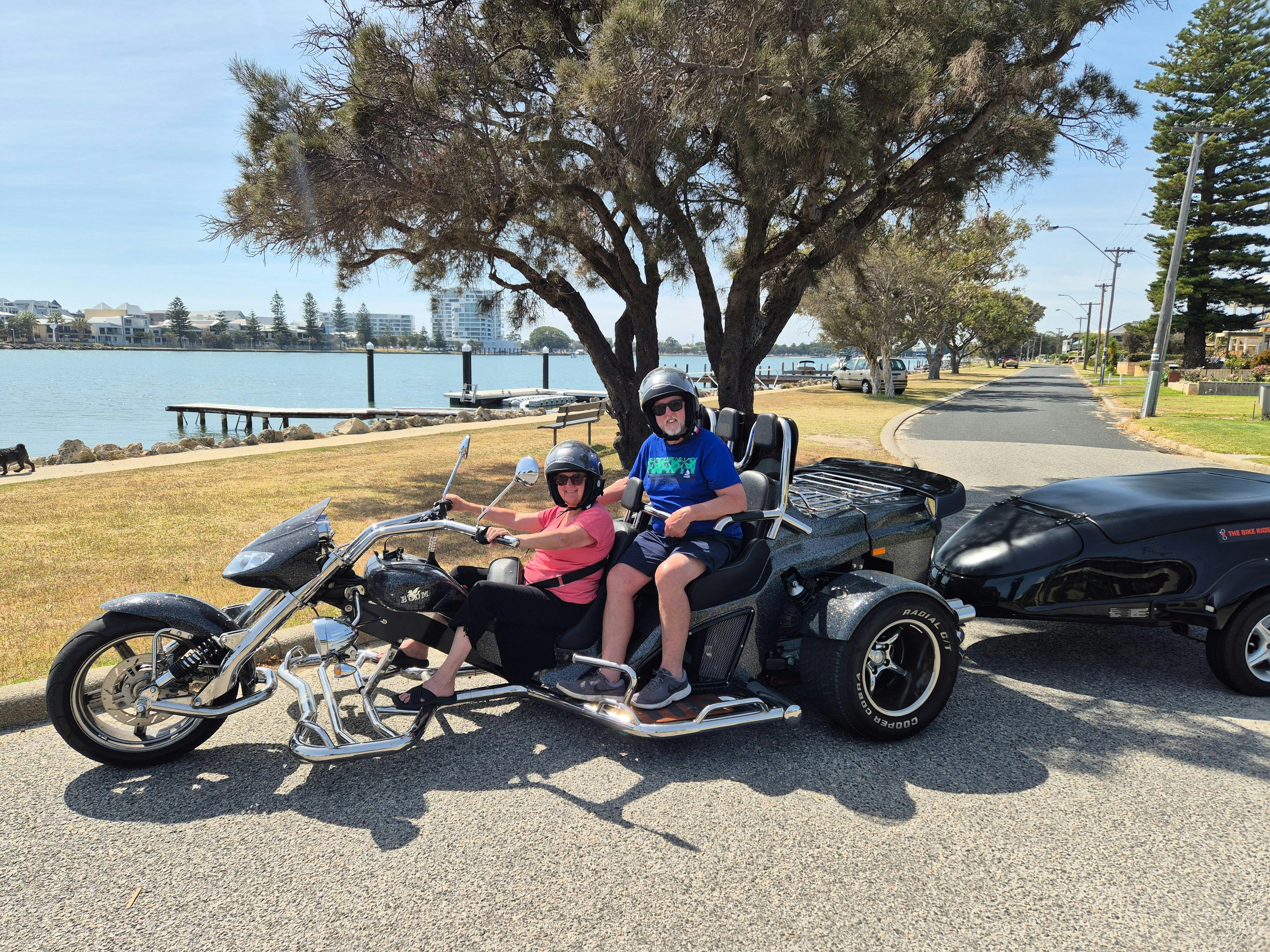 Picture is to be sent to their children they have just  bought a Trike