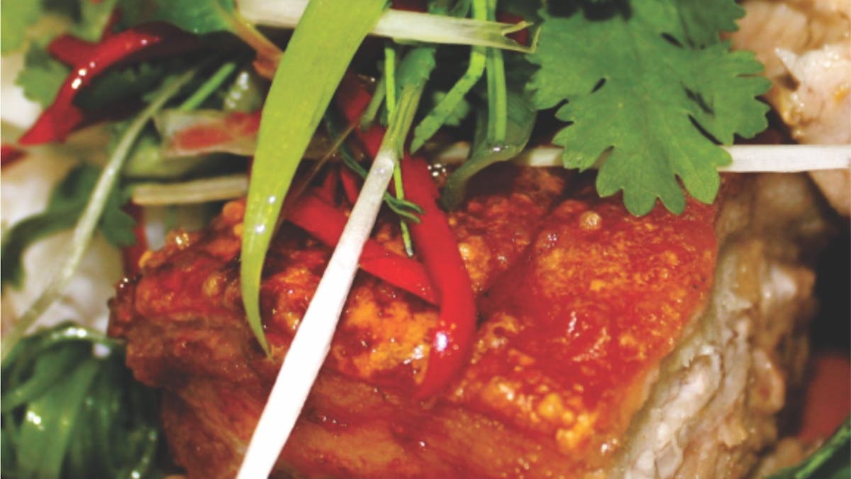 Twice Cooked Pork Belly, chilli plum sauce, served on potato mash and sesonal greens