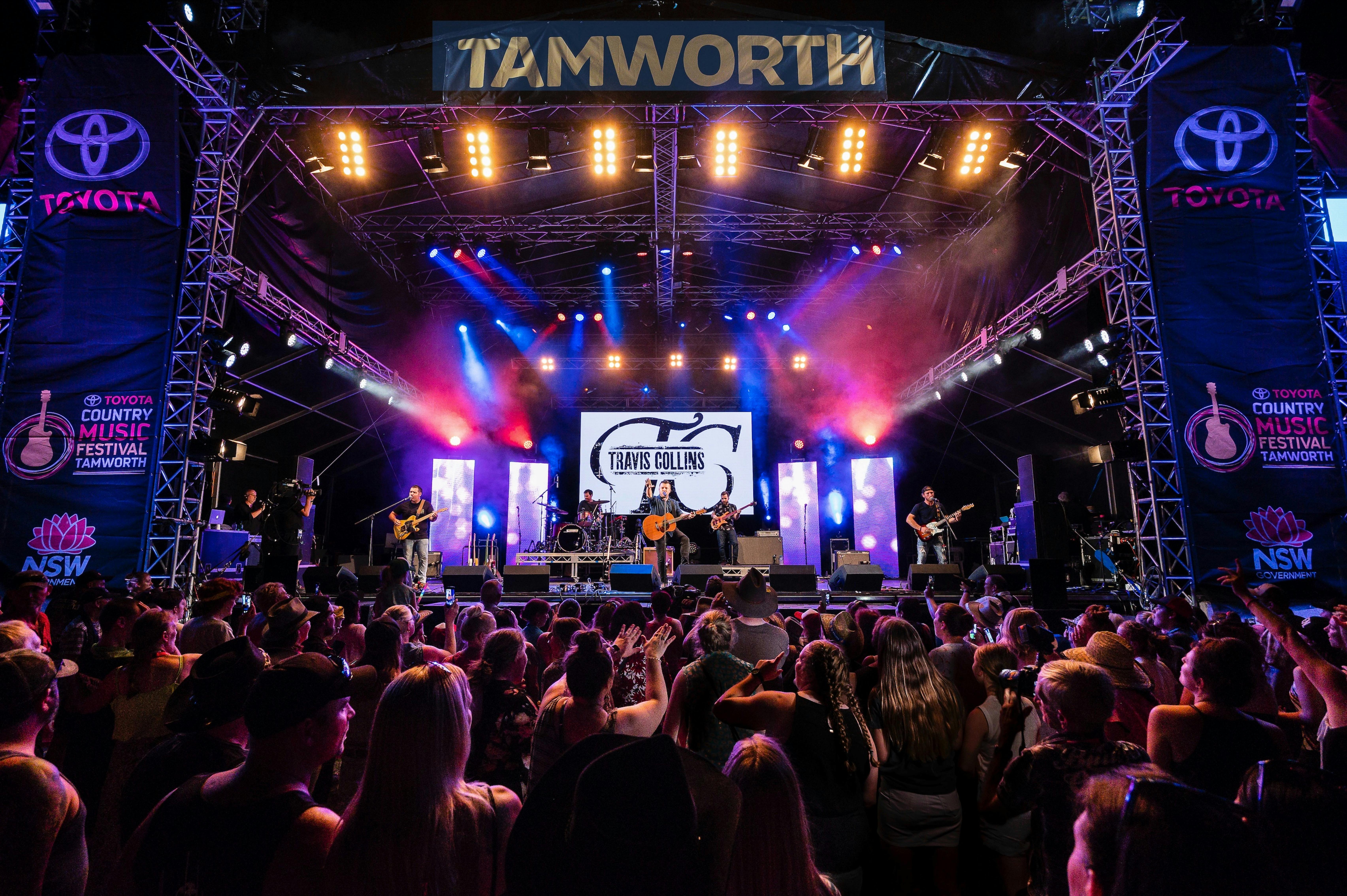 Bright purple and blue lights shine a Tamworth Country Music Festival stage