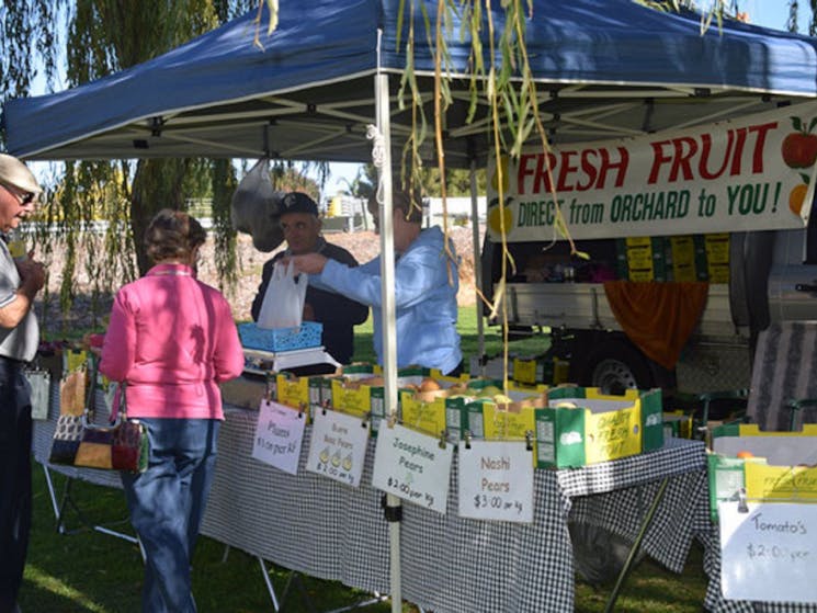 A stall selling stone fruits