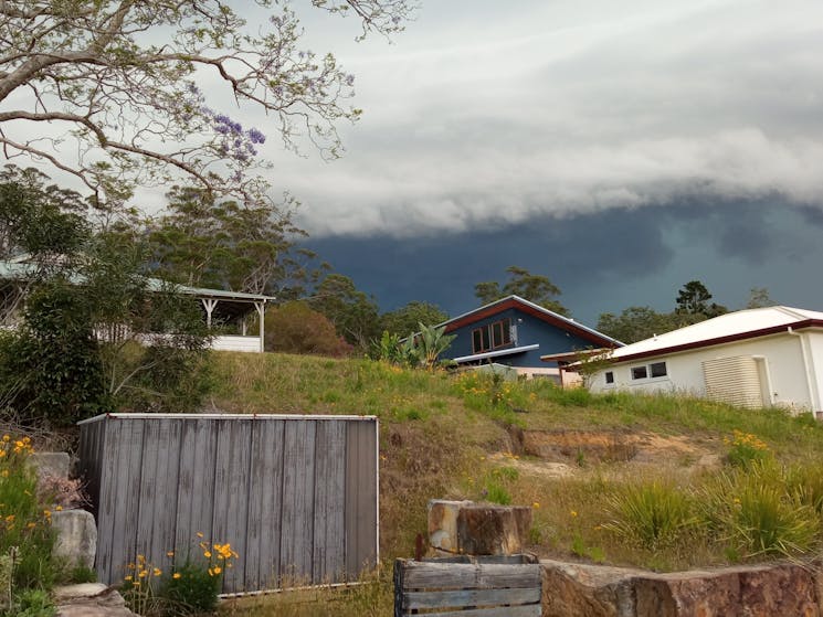 Heavy clouds over several homes in the village