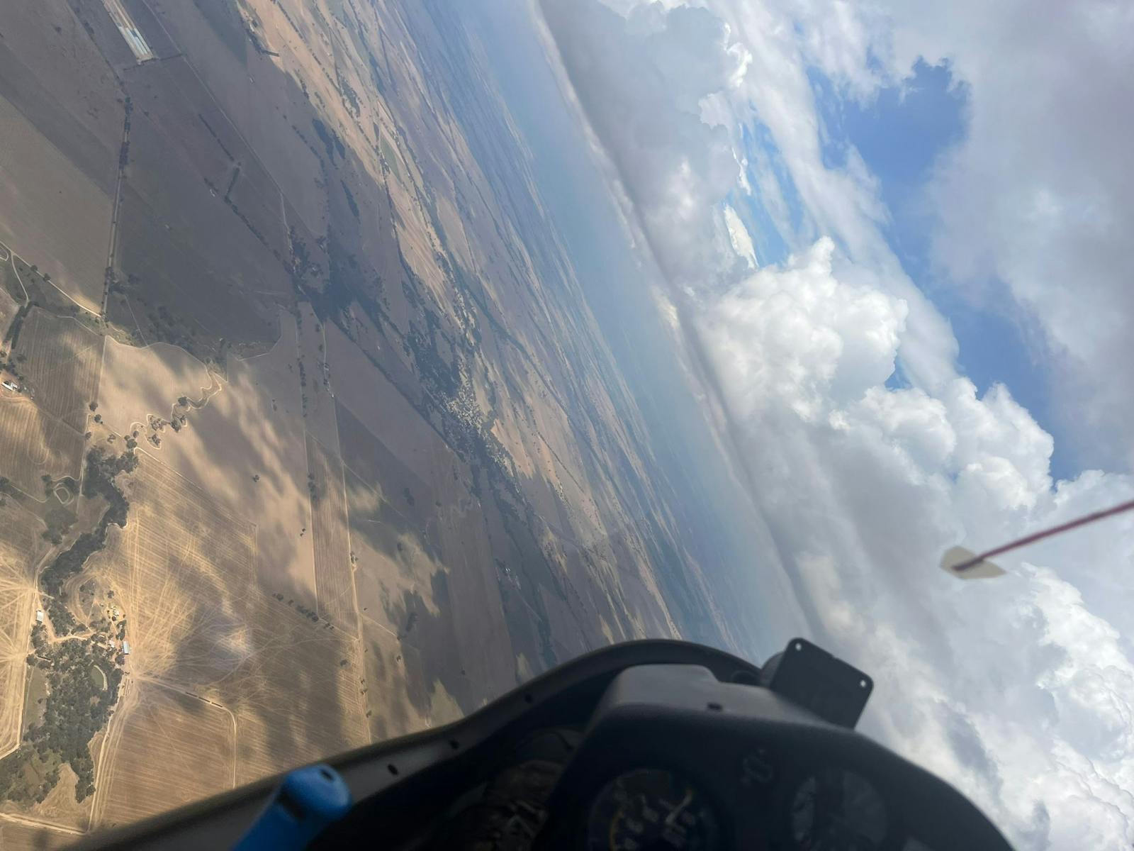 View of horizon on an angle from cockpit of glider