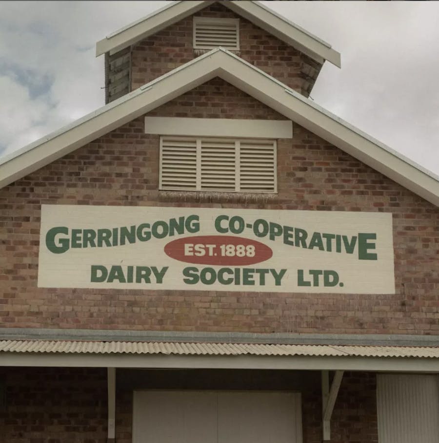Heritage sign on front of building that reads Gerringong C0-operative Dairy Society