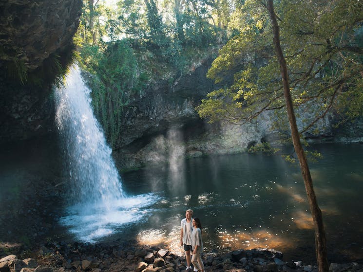 Couple enjoying a scenic bush walk to Killen Falls, Tintenbar