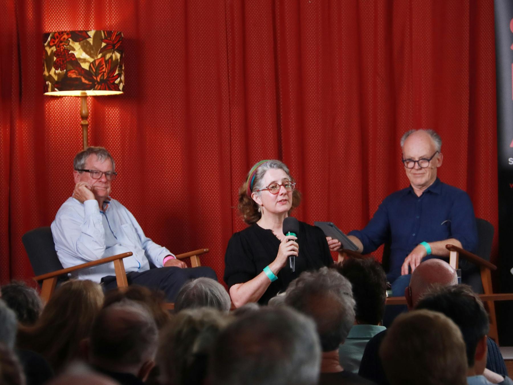 Writer Chris Masters talking to historian Mark Mckenna on stage at the festival with MC Becky Lupton