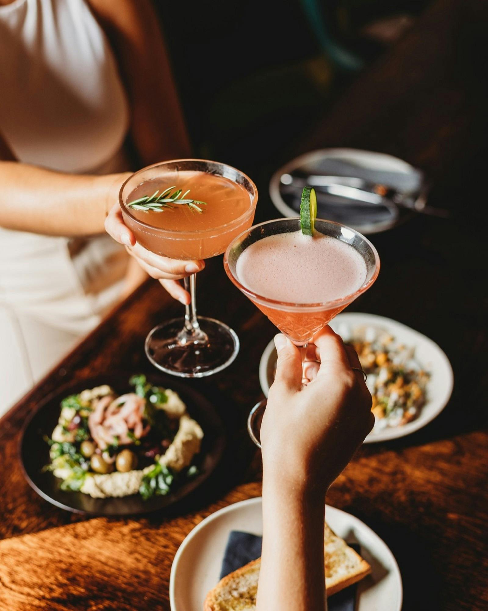 Cocktail drinks being clinked