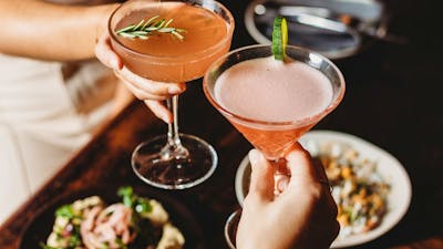 Cocktail drinks being clinked