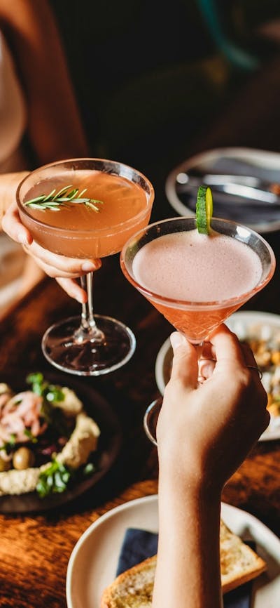 Cocktail drinks being clinked