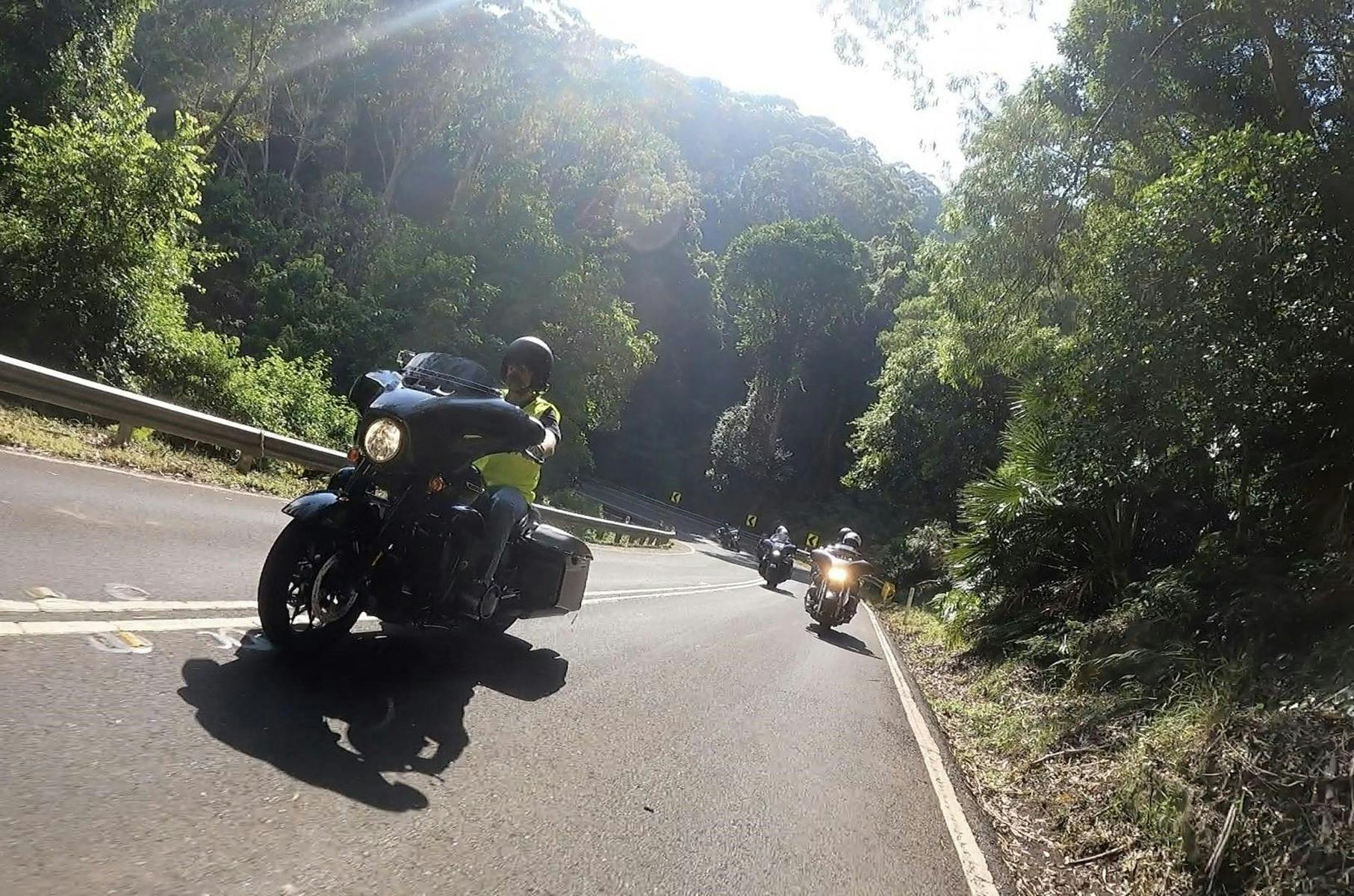 Motorcycles rounding a bend in Royal National Park