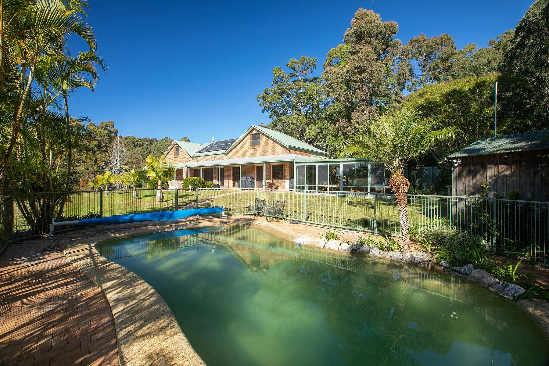 Swimming pool with the house in the background
