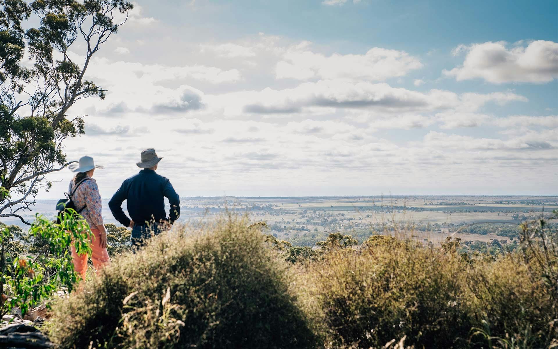 Two guests looking out at a valley