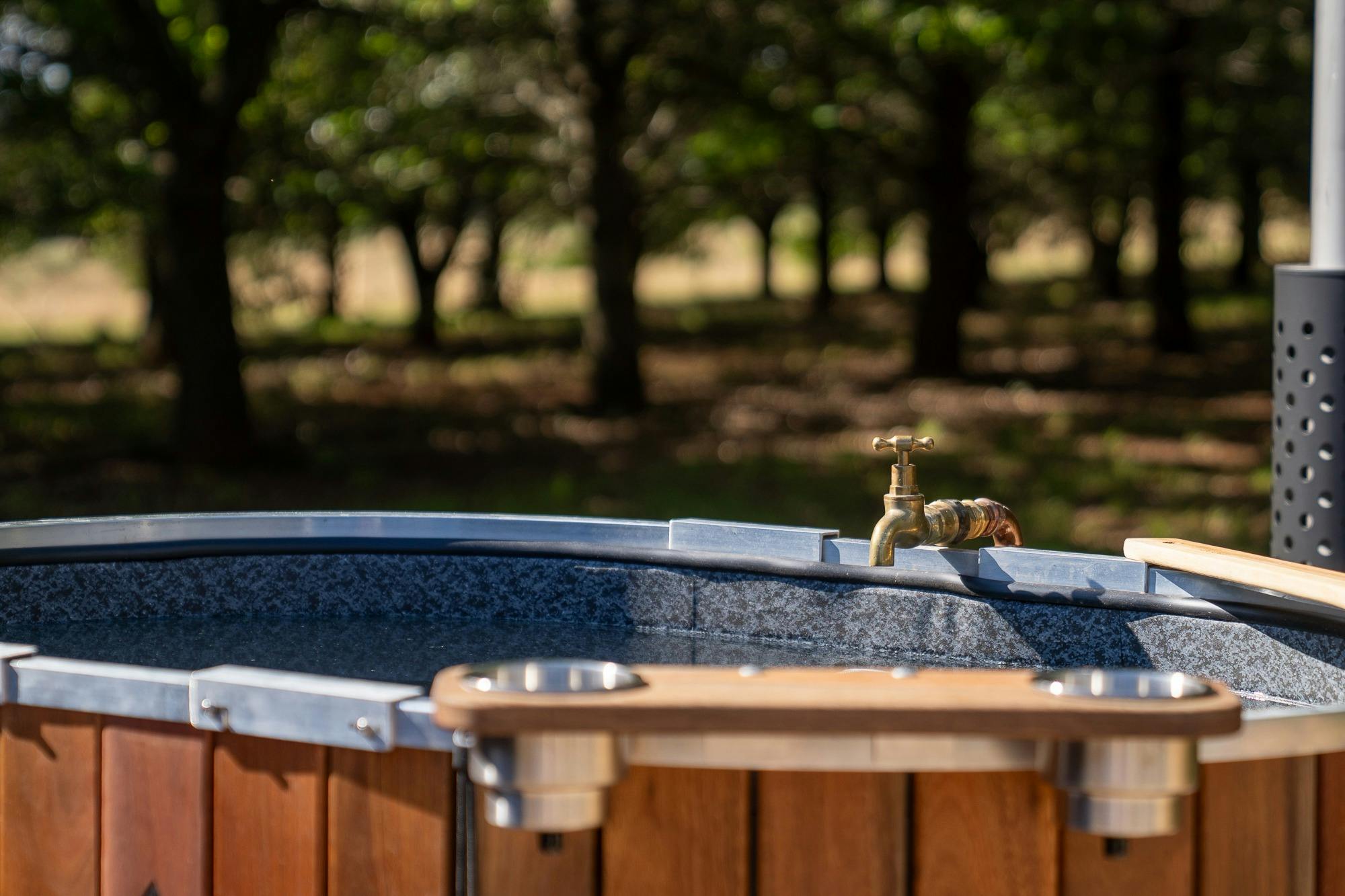Heated by woodfire, this hot tub is ultimate relaxation spot at The Shack