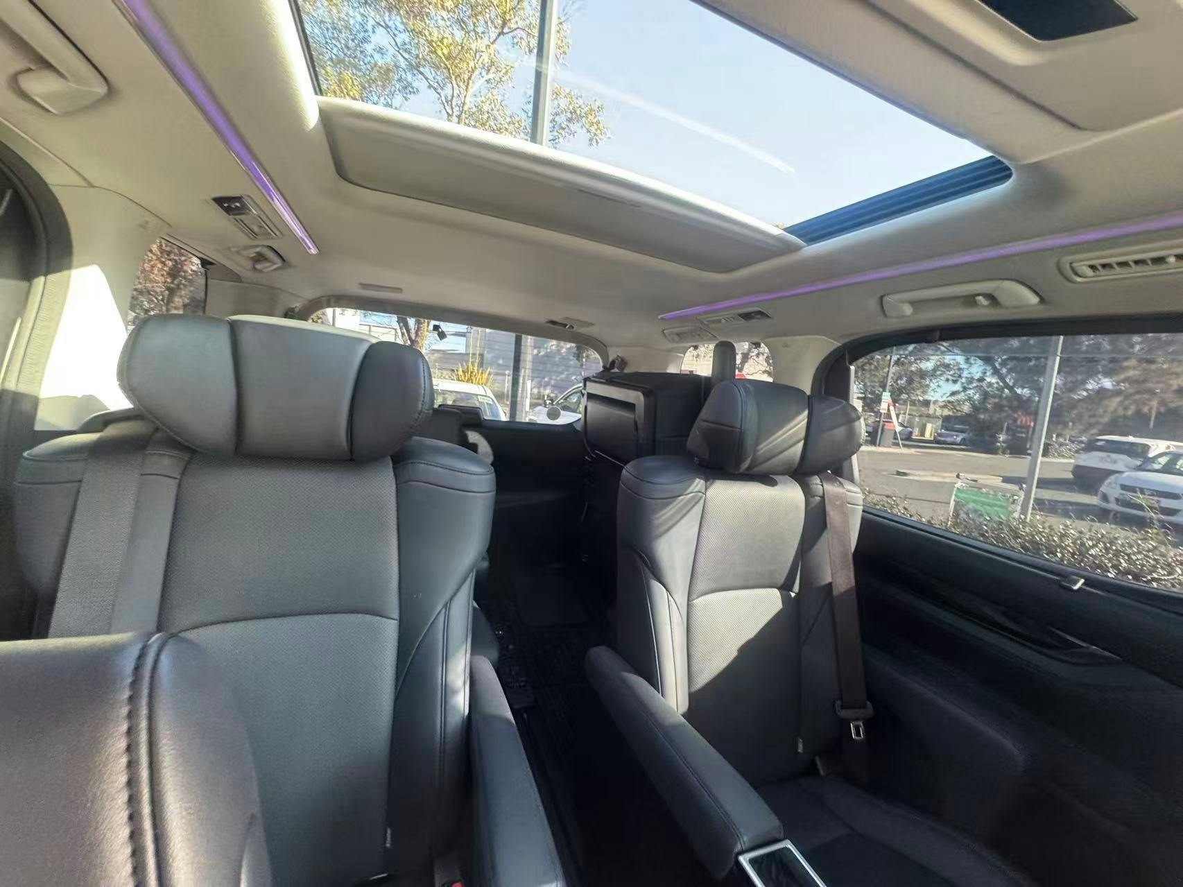 Leather captain seats and sunroof inside the Toyota Alphard