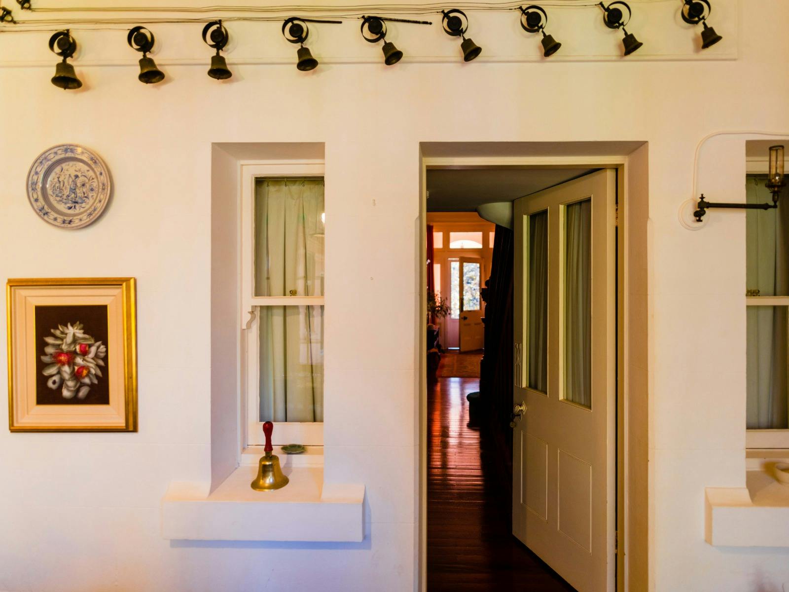 Servant bells line a wall