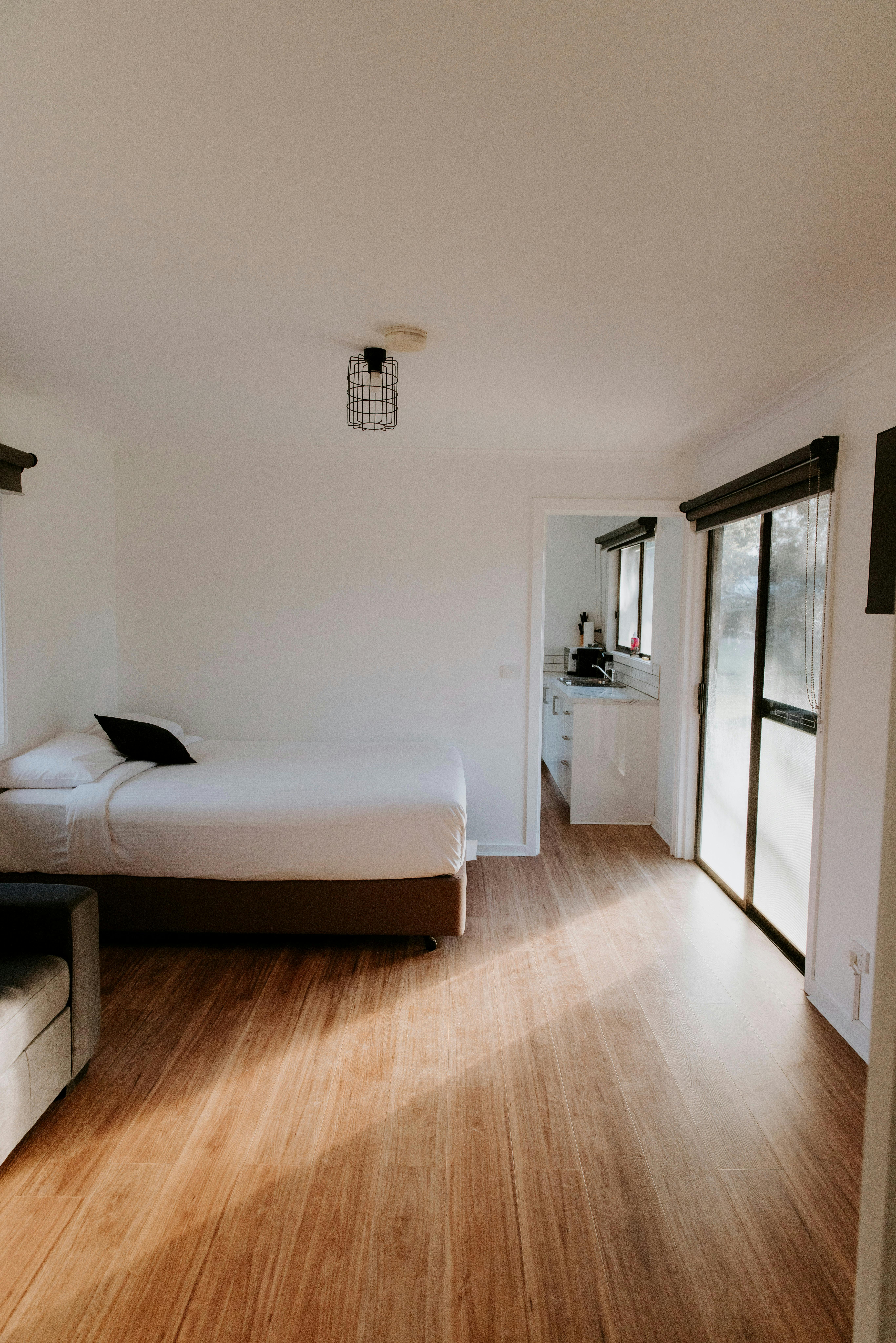 A queen bed in the Deluxe View Cabins at The Paddock at Ulupna