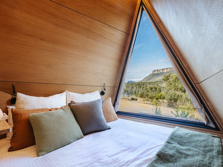Queen size bed with escarpment views