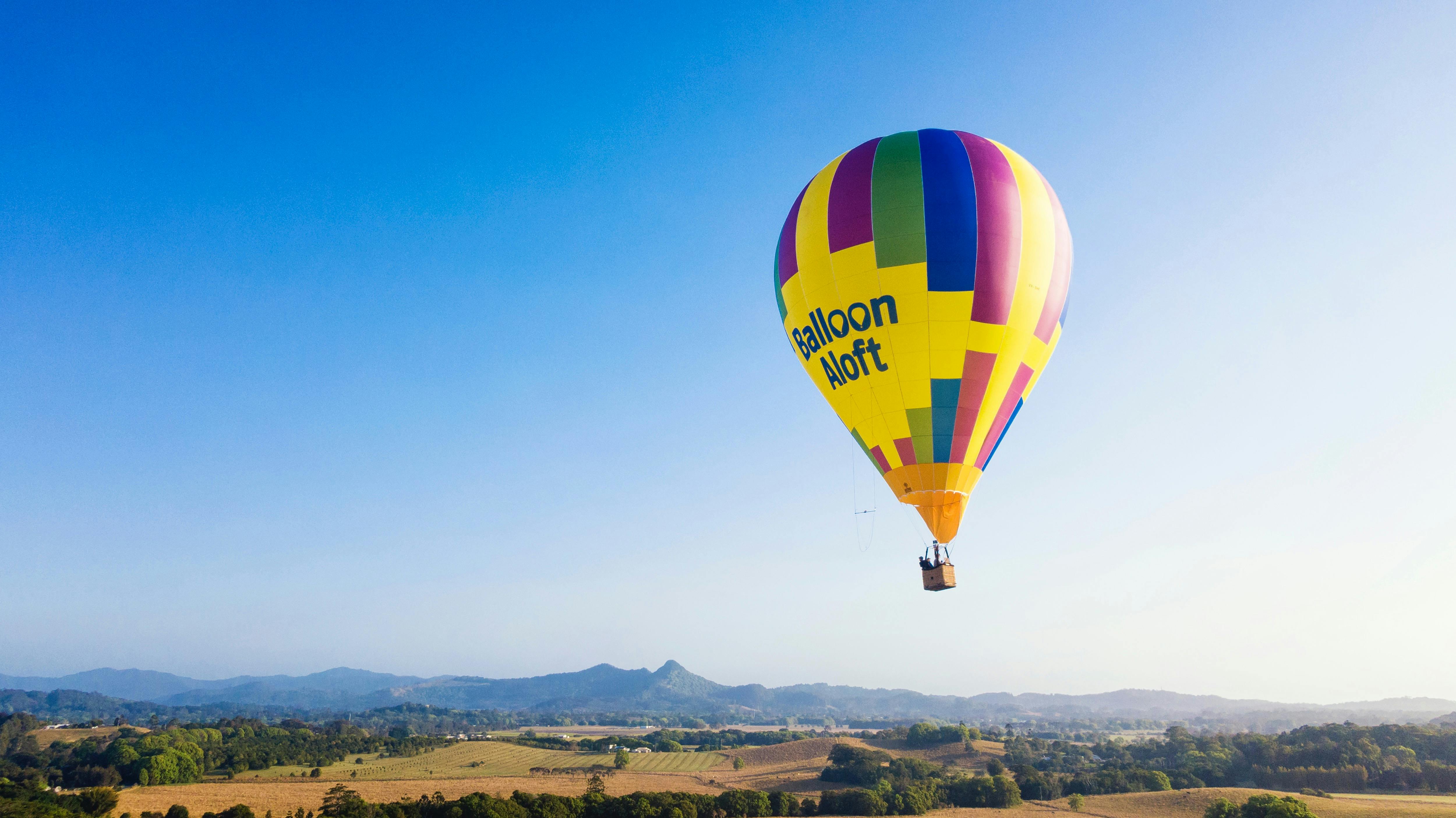 Hot air balloon flying over Byron Bay Hinterland