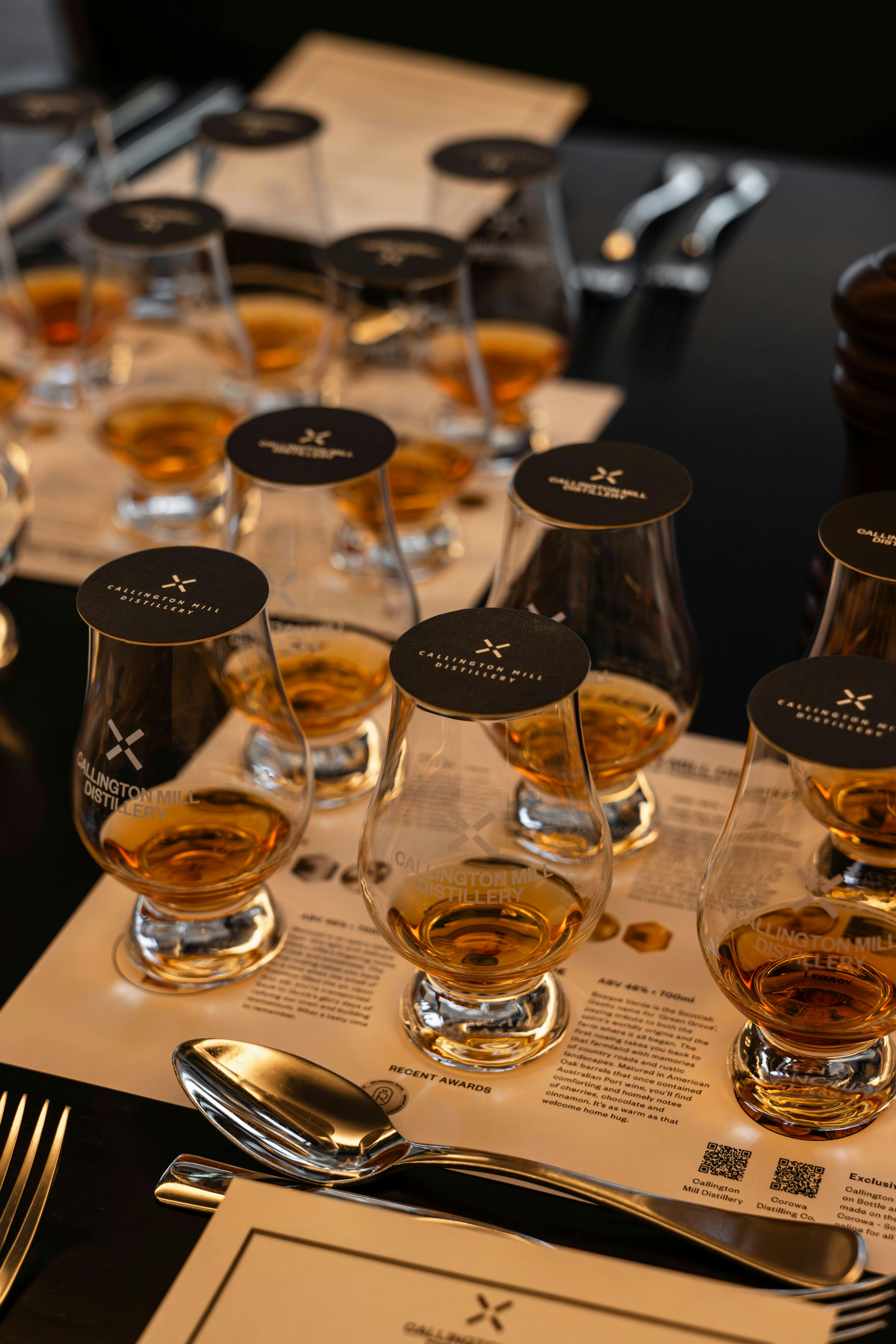 Glen cairn glasses of whisky on a tasting mat