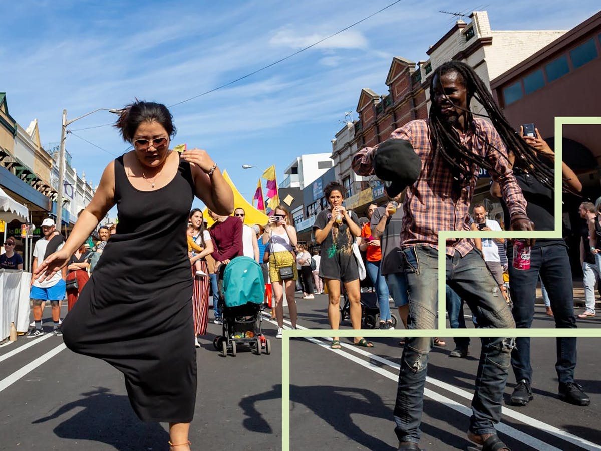 A group of people dancing in the street